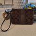 Coach Bags | Euc Coach Monogram Mini Wristlet | Color: Brown | Size: Os