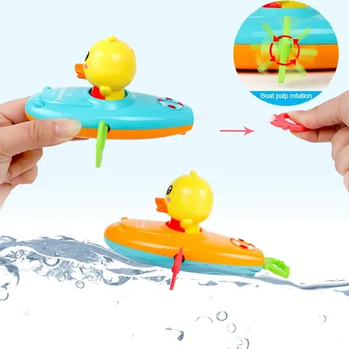 1 stücke niedlichen Cartoon Ente Bad Spielzeug klassische Wasser Spielzeug zurück Ruderboot Baby Bad