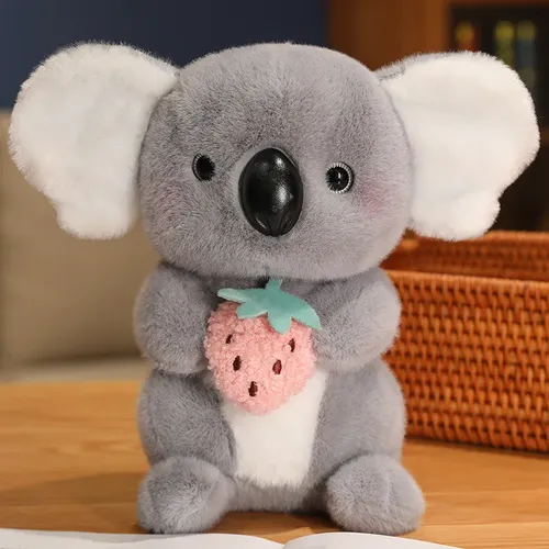 Niedlicher grauer schüchterner Netflix kleiner Koala der Erdbeer plüsch puppe umarmt
