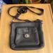 Coach Bags | Coach Black Pebbled Leather Turn Lock Pocket Swingpack Crossbody Bag F45012 | Color: Black/Silver | Size: Os