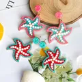 Boucles d'oreilles en alliage de perles de riz étoile de mer pour femmes boucles d'oreilles à thème