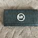 Michael Kors Bags | Ladies Michael Kors Bifold Wallet With Mk Logo | Color: Black | Size: Medium