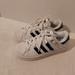 Adidas Shoes | Adidas Women's Superstars Bonega Sneakers Size 7 Black & White/ Gold Metallic | Color: Black/White | Size: 7