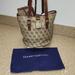 Dooney & Bourke Bags | Dooney And Bourke Euc Shoulder Bag With Matching Wristlet And Dust Bag | Color: Brown/Tan | Size: Os