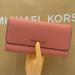 Michael Kors Bags | Michael Kors Jet Set Travel Large Trifold Wallet Sherbert Color Nwt | Color: Gold/Pink | Size: Large