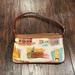 Dooney & Bourke Bags | Disney Dooney & Bourke Disney World Retro Slim Wristlet Retired Euc | Color: Tan/White | Size: Os