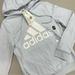 Adidas Tops | Adidas Light Blue Hoodie White Graphic Hooded Sweater Pockets Womens Size Xs Nwt | Color: Blue/White | Size: Xs