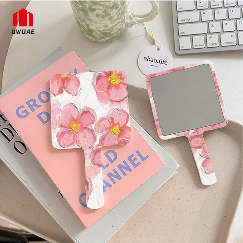 Kleiner tragbarer Make-up-Spiegel am Griff, Mini-Taschen-Kosmetikspiegel mit quadratischer Blume, Ins-Frauen und Mädchen, hochauflösende kosmetische Werkzeuge