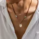 Minimalist ische natürliche Muschel Leder Halskette für Männer Doppel herz Imitation Perlenkette