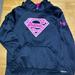 Under Armour Shirts & Tops | Girls’ Under Armour Supergirl Sweatshirt In Black Fabric With Hot Pink Print Ec | Color: Black/Pink | Size: Mg