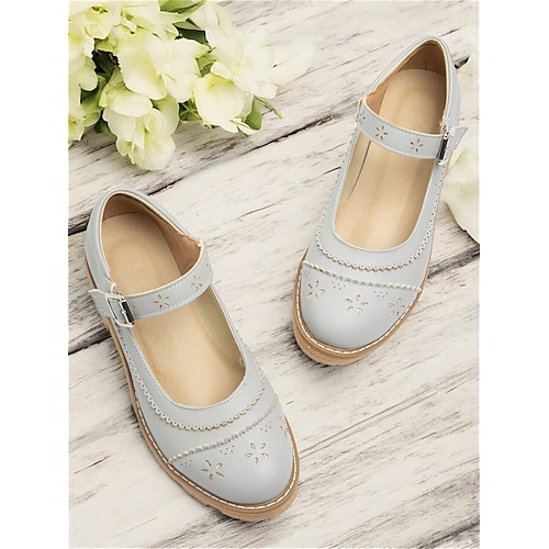 Damen-Ballerinas im Vintage-Stil aus grauem Leder mit ausgeschnittenem Blumenmuster und Schnallenriemen, perfekt für Freizeit- und formelle Anlässe Image