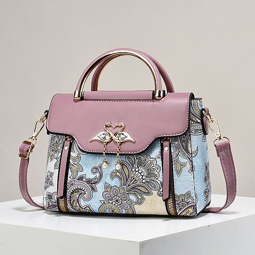 Elegante Damenhandtasche mit Schwanenanhänger – schwarz-weißes Paisley-Design mit goldenen Akzenten und verstellbarem Riemen