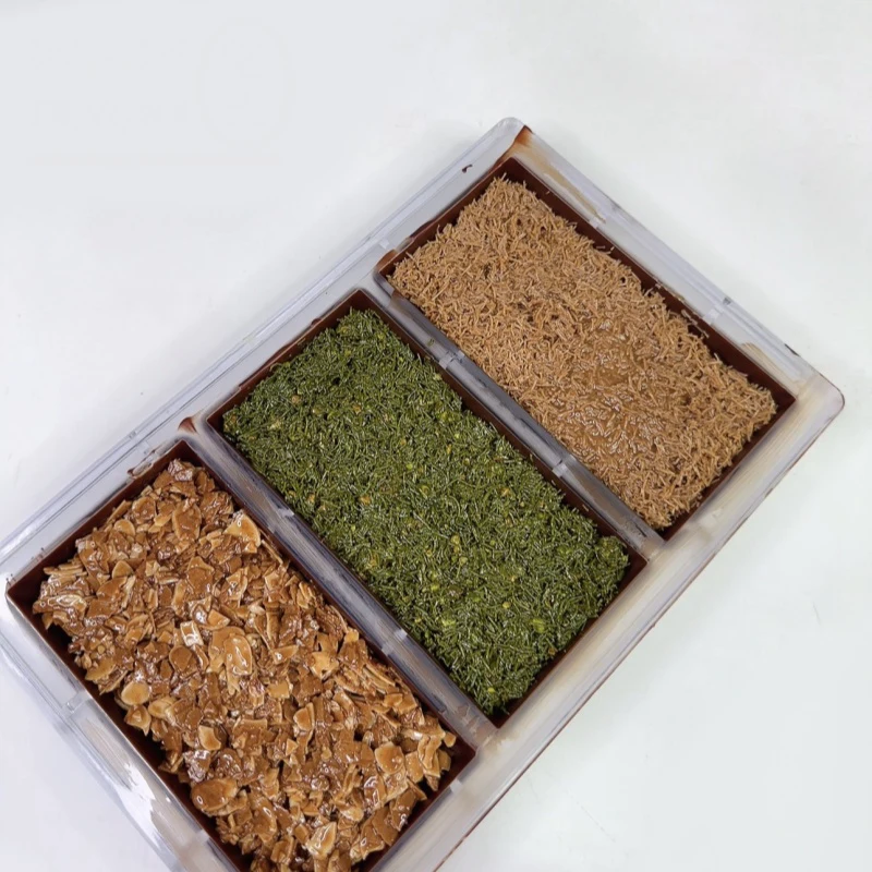 Silikon- oder Polycarbonat-Schokoladenformen, PC-Schokoriegelformen, Nusssauce, Brot, Fetzen gefüllte Backwerkzeuge für Schokolade und Süßigkeiten Image