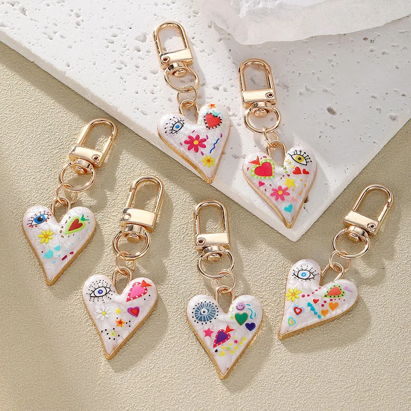 Neue gedruckte Tropf öl Teufels auge Schlüssel bund für Frauen Mode Blume Herz Gold Farbe Schlüssel Schnalle Tasche Kopfhörer Fall Schmuck Geschenk Image