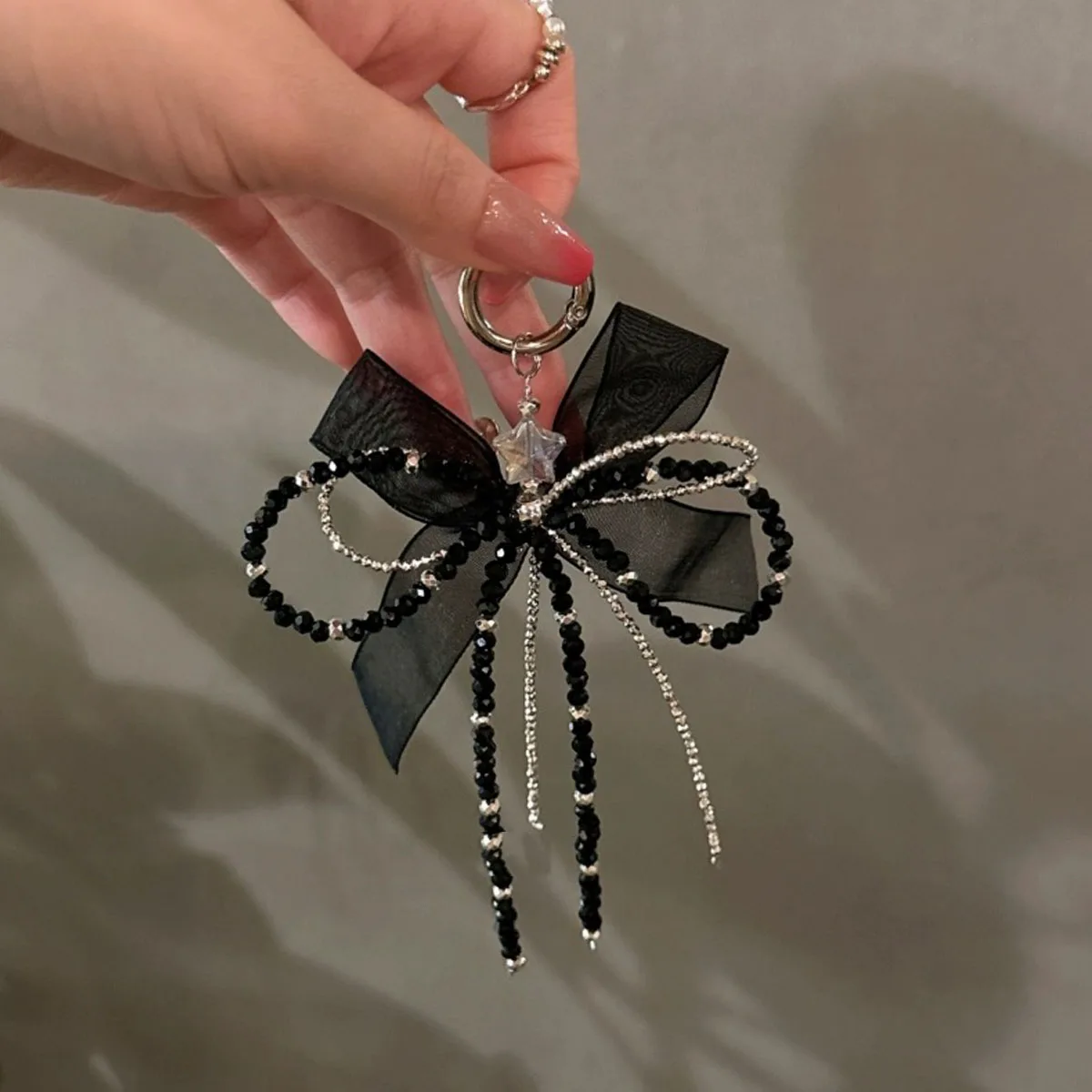 Schwarz gebrochenes Silber würziges Mädchen Bogen Telefon kette geeignet für iPhone Fall universelle hängende Riemen Mädchen trendy Image