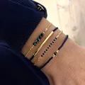 Set di braccialetti in pietra di vetro nero fatti a mano per le donne Gioielli di moda con braccialetti a catena a maglie con perline di riso impilati multistrato bohémien