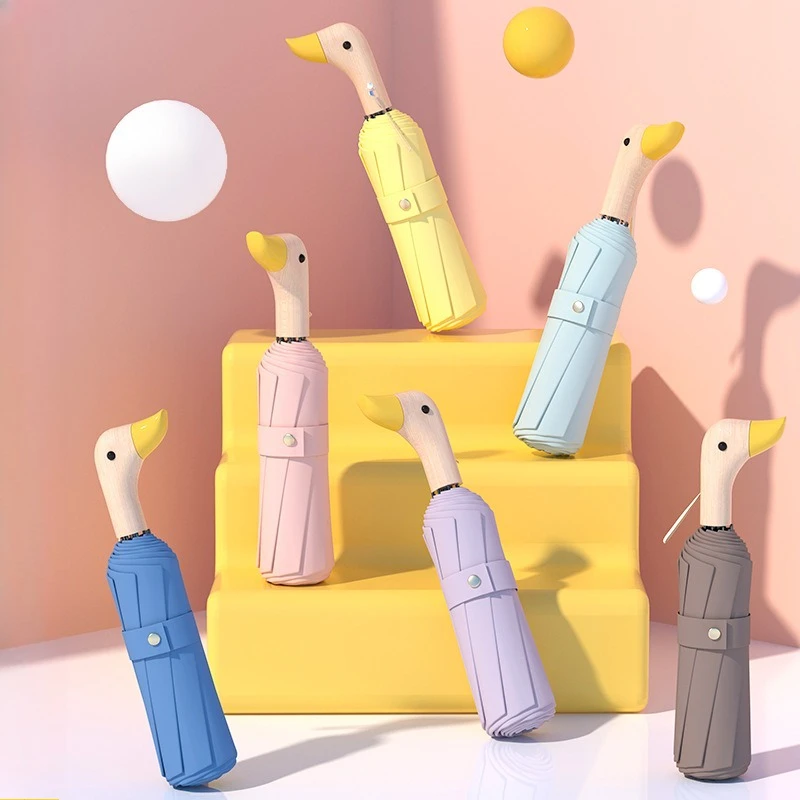 Enten-Regenschirm, tragbar, faltbar, Cartoon-Stil, niedlicher schwarzer Kleber, Sonnenschutz-Regenschirm mit Holzgriff, kleiner gelber Enten-Regenschirm Image