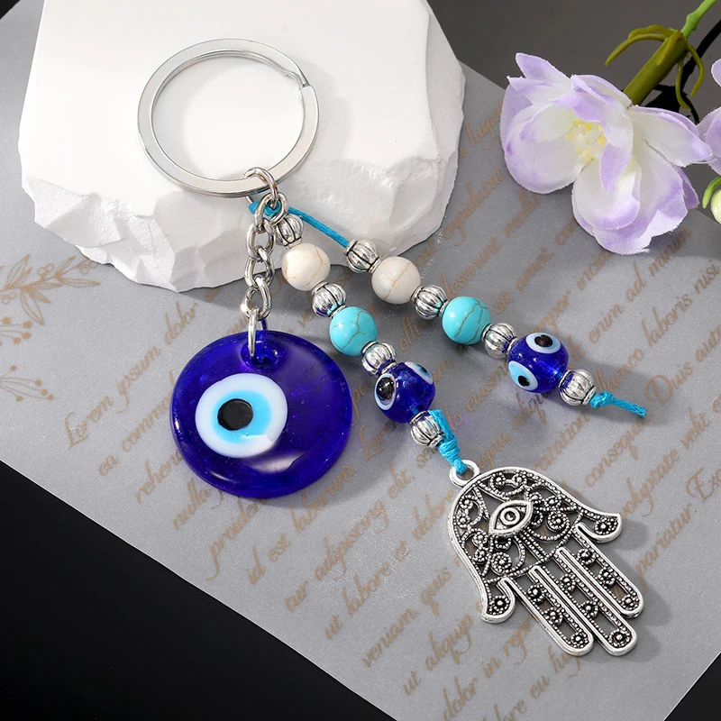 Blauer böser Blick Hamsa Hand Perlen Schlüsselanhänger Schlüsselanhänger für Frauen Männer Glas Vintage rundes türkisches Auge Fatima Hand Quaste Tasche Auto Schmuck Image