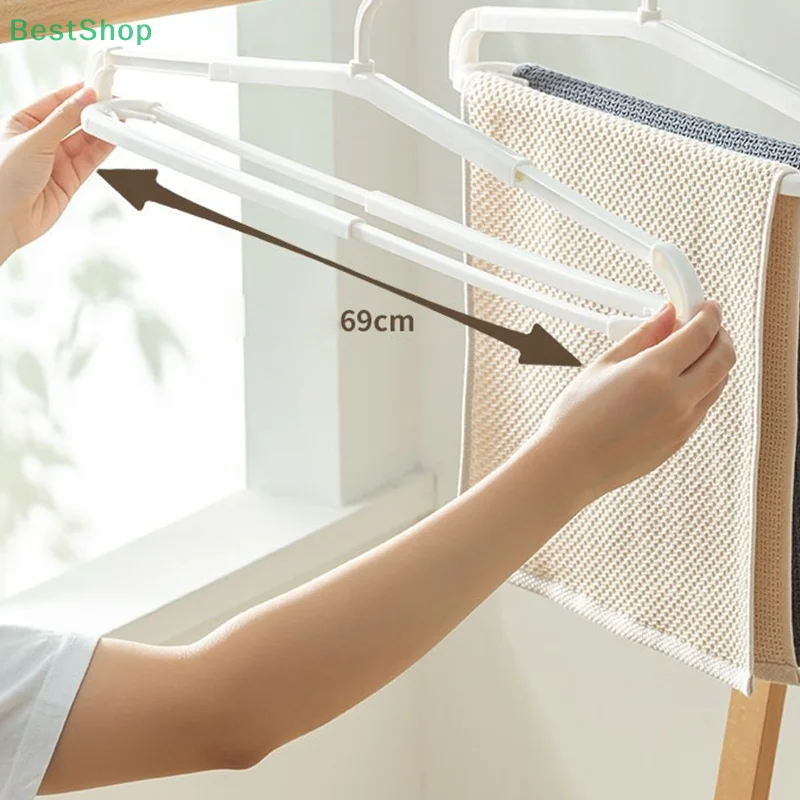    Dehnbarer Wäscheständer, rutschfest, drehbar, platzsparend, erweiterbar Image