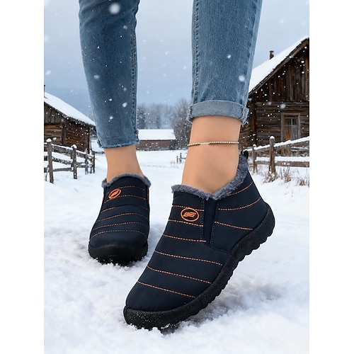 orangefarbene, wasserdichte Schneestiefel für Damen mit warmem Plüschfutter, leichte Winterschuhe zum Hineinschlüpfen für kaltes Wetter im Freien und im Halloween-Stil Image