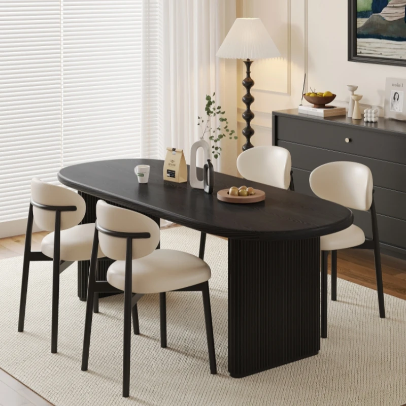 Französische Retro-Massivholz-Oval-Esstisch- und Stuhlkombination, stunnierter Wind-Esstisch aus schwarzem Eschenholz für den Haushalt, kleine Wohnung