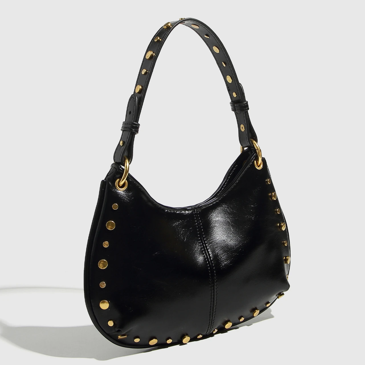 Mode 2025 sac sous les bras nouveau sac de selle à chaîne rivetée à la mode vin rouge noir sac à main à bandoulière unique pour les femmes