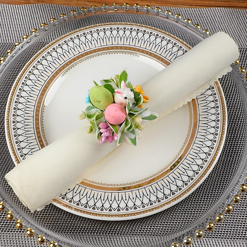 6 Stück Serviettenringe mit Osterhasenmotiv, frühlingshafte Serviettenhalter mit Hasen, gesprenkelten Eiern und Gänseblümchen, Tischdekoration im Landhausstil für die Osterfeier, Serviettenringe mit Grünpflanzen Image