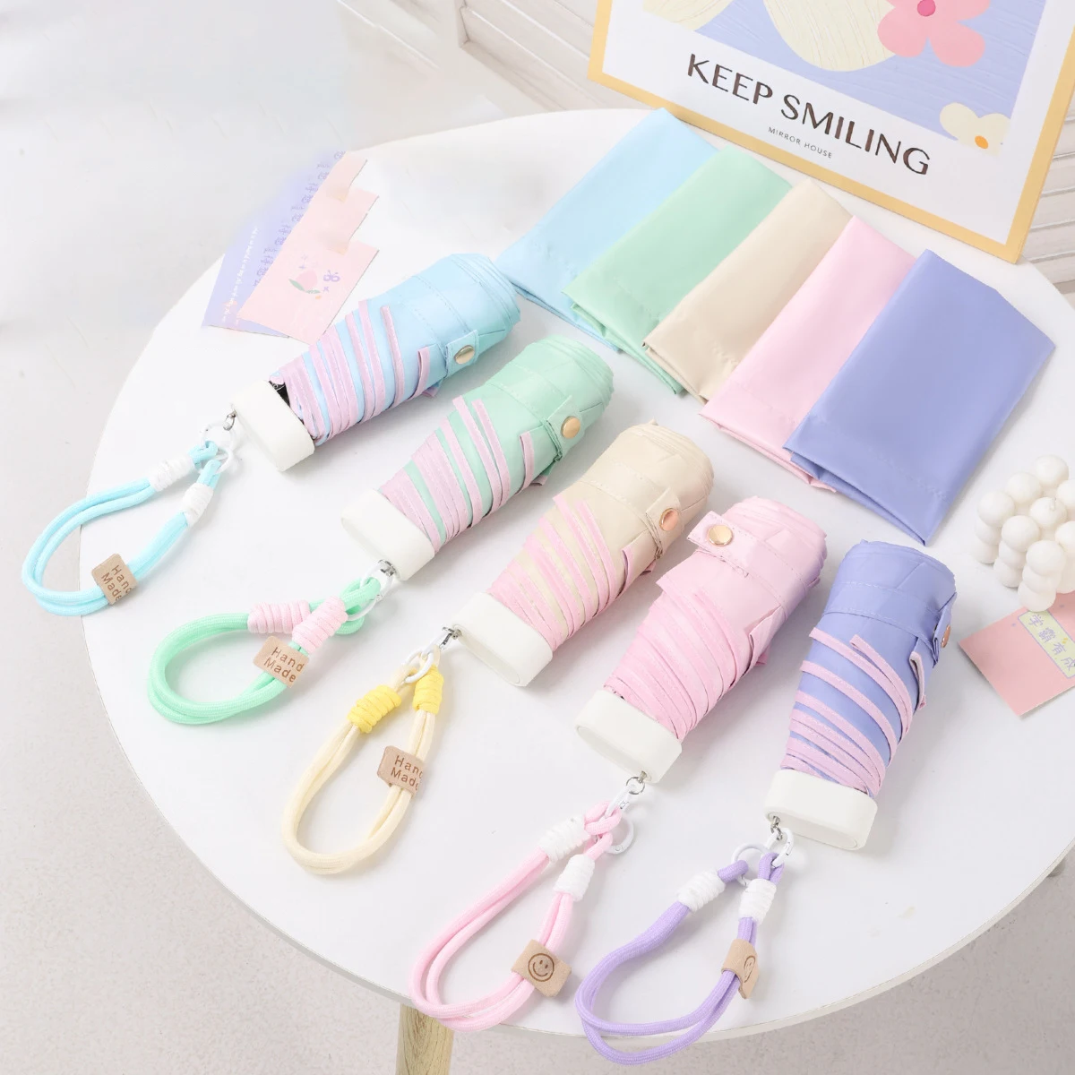 Ultraleichter Farbseil-Regenschirm mit fünf Fächern, kompakt und tragbar, Sonnenschirm, Sonnenschutz aus schwarzem Gummi, UV-Schutz, Image