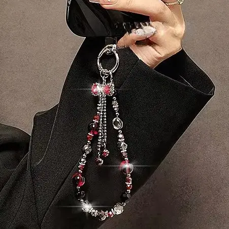 Chaîne courte pour téléphone avec nœud et pompon, cordon de téléphone en cristal, cordon universel anti-perte pour téléphone, dragonne courte tendance pour téléphone portable