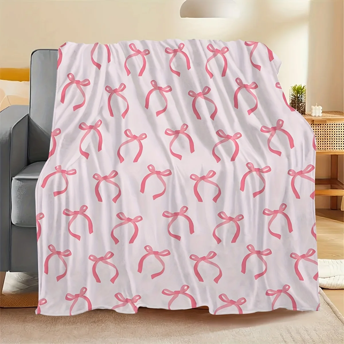 Flanelldecke, verziert mit niedlichem rosa Schleifendesign, ideal zum Bringen einer schönen Stimmung für Schlafzimmer und bequeme Nickerchenflecken, weich Image