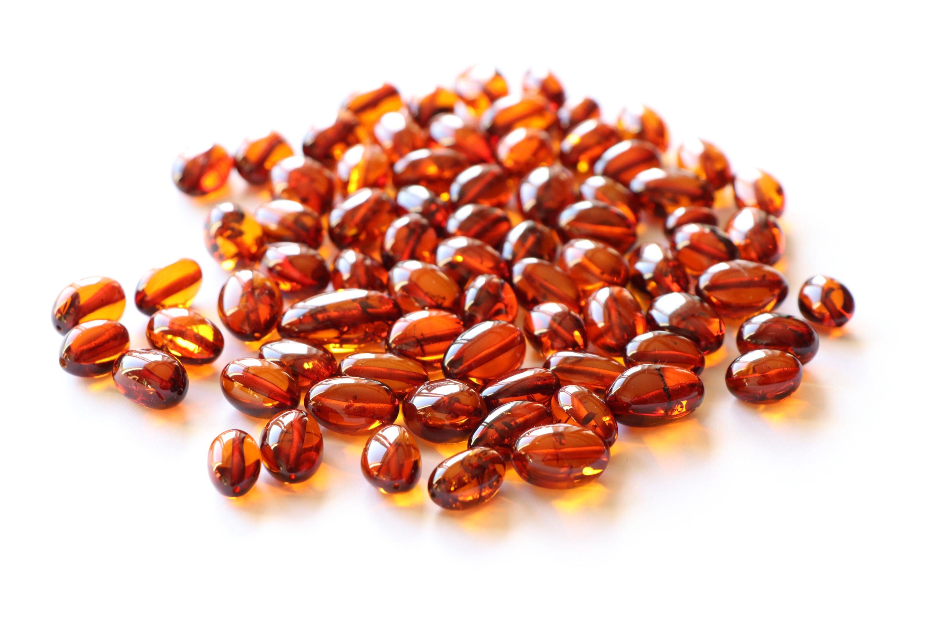 Pezzi di ambra cognac con foro, perline di ambra di forma ovale, pietre di ambra sfuse, perline di ambra con foro, pezzi di ambra cognac forati, ambra