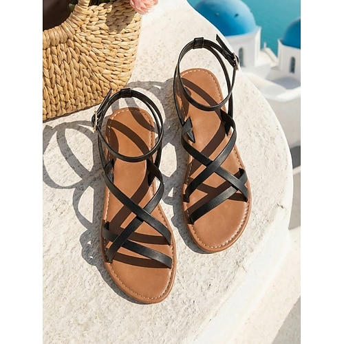 Minimalistische braune Riemchensandalen für Damen – bequeme, flache Gladiatorensandalen im griechischen Stil mit Knöchelriemen für Strandurlaub und Sommerreisen auf die Insel. Boho-Urlaubsoutfits Image