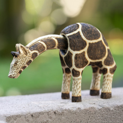 'Javanese-Made Hand-Carved Mobile Giraffe Pule Wood Sculpture'
