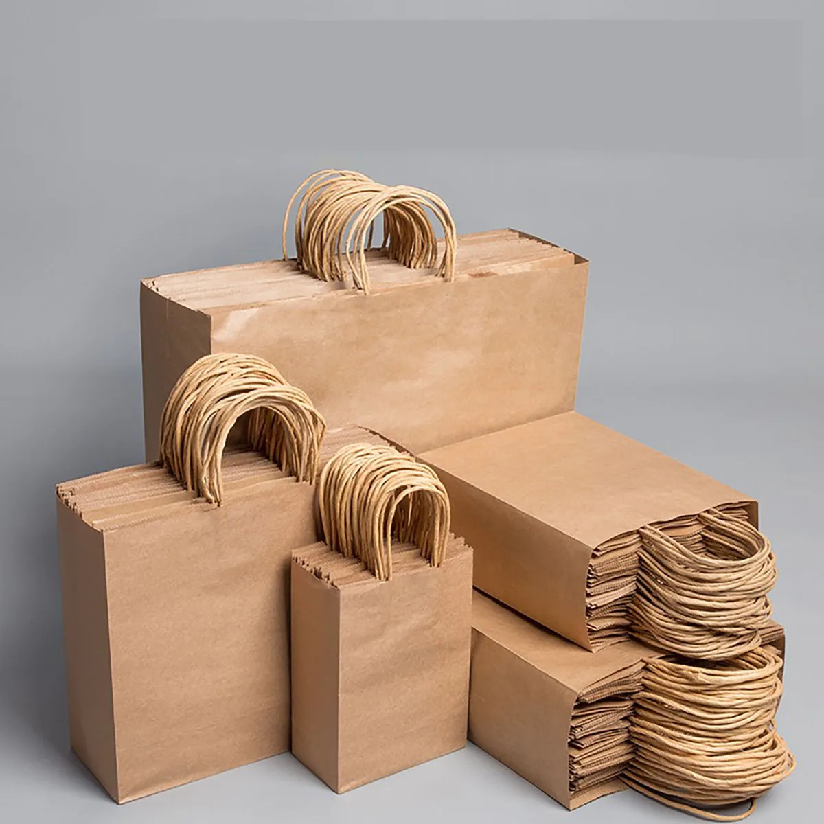 10 teile/los Kraft Papier Tasche mit Griffen Geschenk Verpackung Taschen für Shop Kleidung Hochzeit Weihnachten Liefert Handtaschen Kit Image