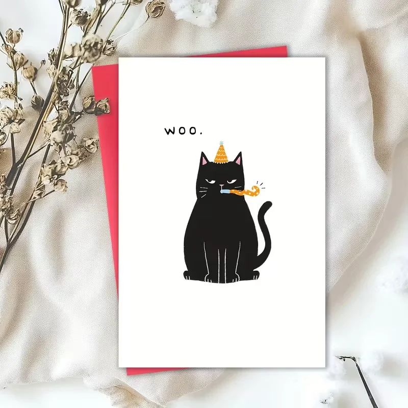 Lustige Geburtstagskarte mit schwarzer Katze, „WOO.“ Zitat mit grummelnder Katze im Partyhut und Gebläse, roter Umschlag im Lieferumfang enthalten Image
