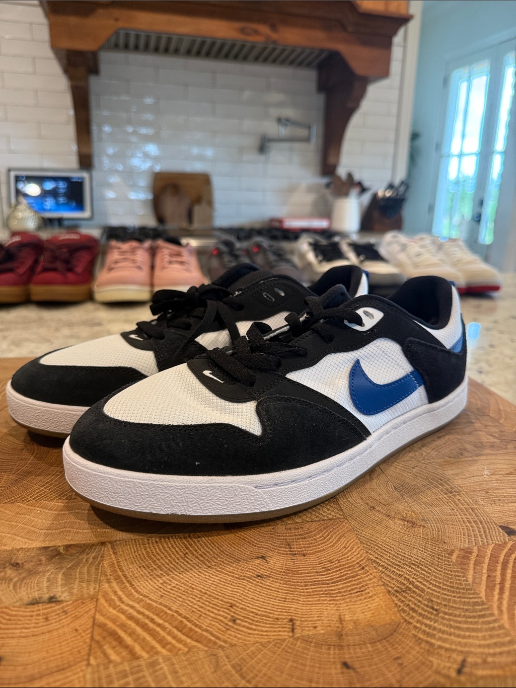 Nike Shoes | Men’s Nike Sb Black And White Low-Top Sneakers With Blue Swoosh | Color: Black/White | Size: 10