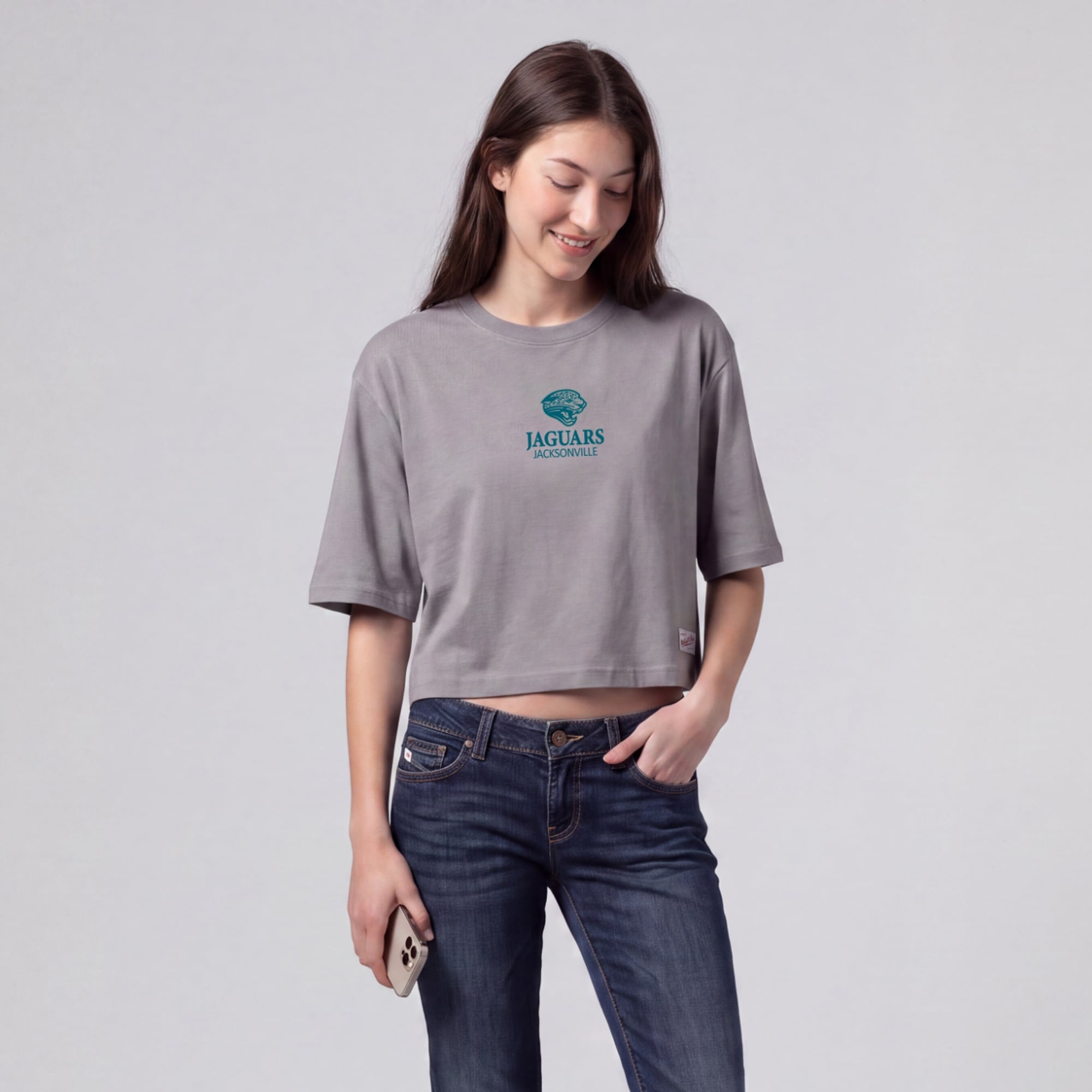 Mitchell & Ness Damen-T-Shirt in Grau mit Jacksonville Jaguars Core Essentials Micro-Logo, kastenförmig geschnitten