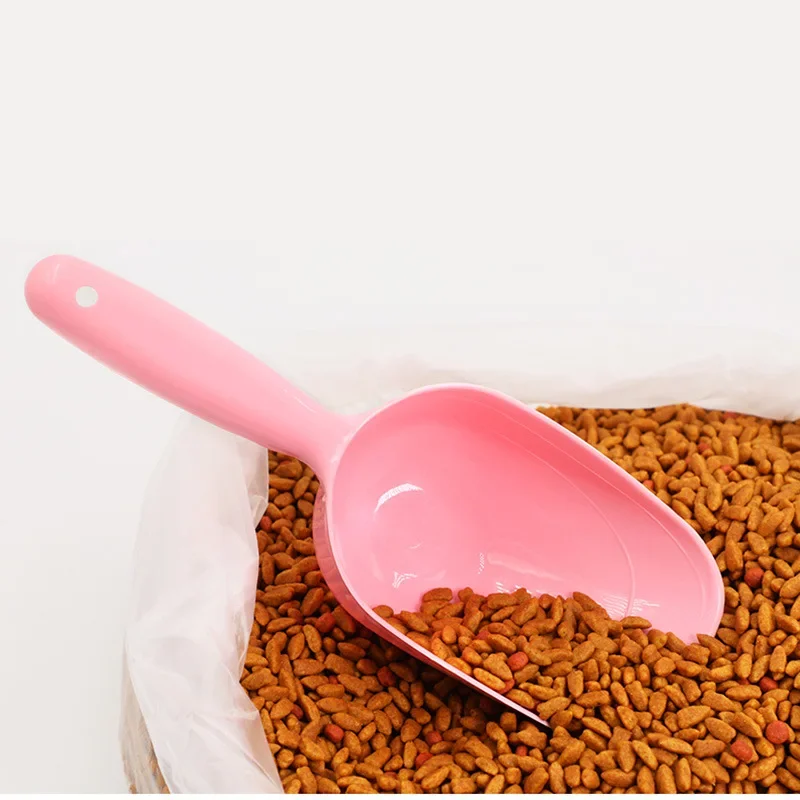 Pelle à nourriture pour animaux de compagnie avec manche et clip pour sac, louche à nourriture en plastique multicolore, cuillère doseuse pratique pour la nourriture sèche pour chiens et chats.