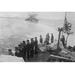 Buyenlarge Naval Crew on Japanese Vessel Salutes Another & Flies - Photograph Print in Black/Gray | 28 H x 42 W x 1.5 D in | Wayfair